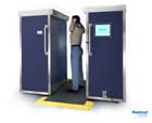 A modern backscatter unit showing a passenger being
								screened.